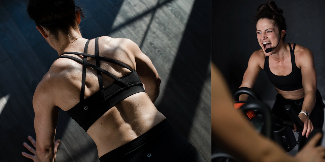A woman cycling intensely on a stationary bike shows the kind of sweat-heavy training session where hydration timing before, during, and after exercise makes the biggest difference.