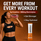 A woman in a black sports bra drinks a pink drink from a clear bottle labeled STACKED, set against a warm brown background with promotional text about creatine and electrolytes, and a STACKED supplement tube shown at the lower right.